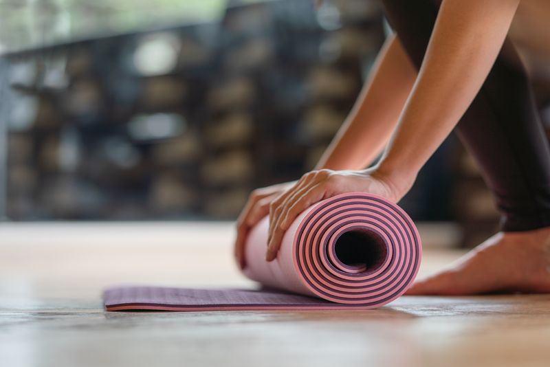 <span  class="uc_style_uc_tiles_grid_image_elementor_uc_items_attribute_title" style="color:#ffffff;">Close-up rolling yoga mat after working out at fitness ,sport and training club.Diversity People Exercise Class Relax Concept</span>